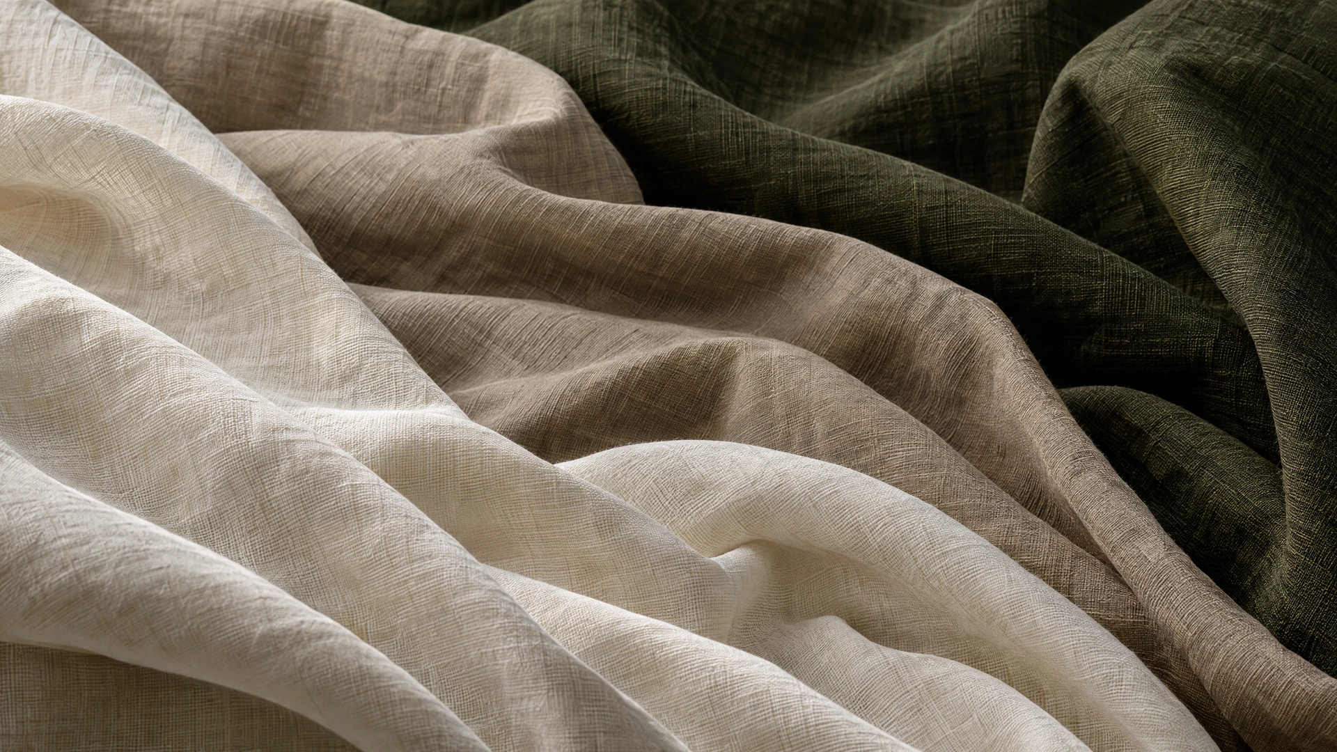 Sculptural folds of ivory linen, warm taupe cotton and olive fabric