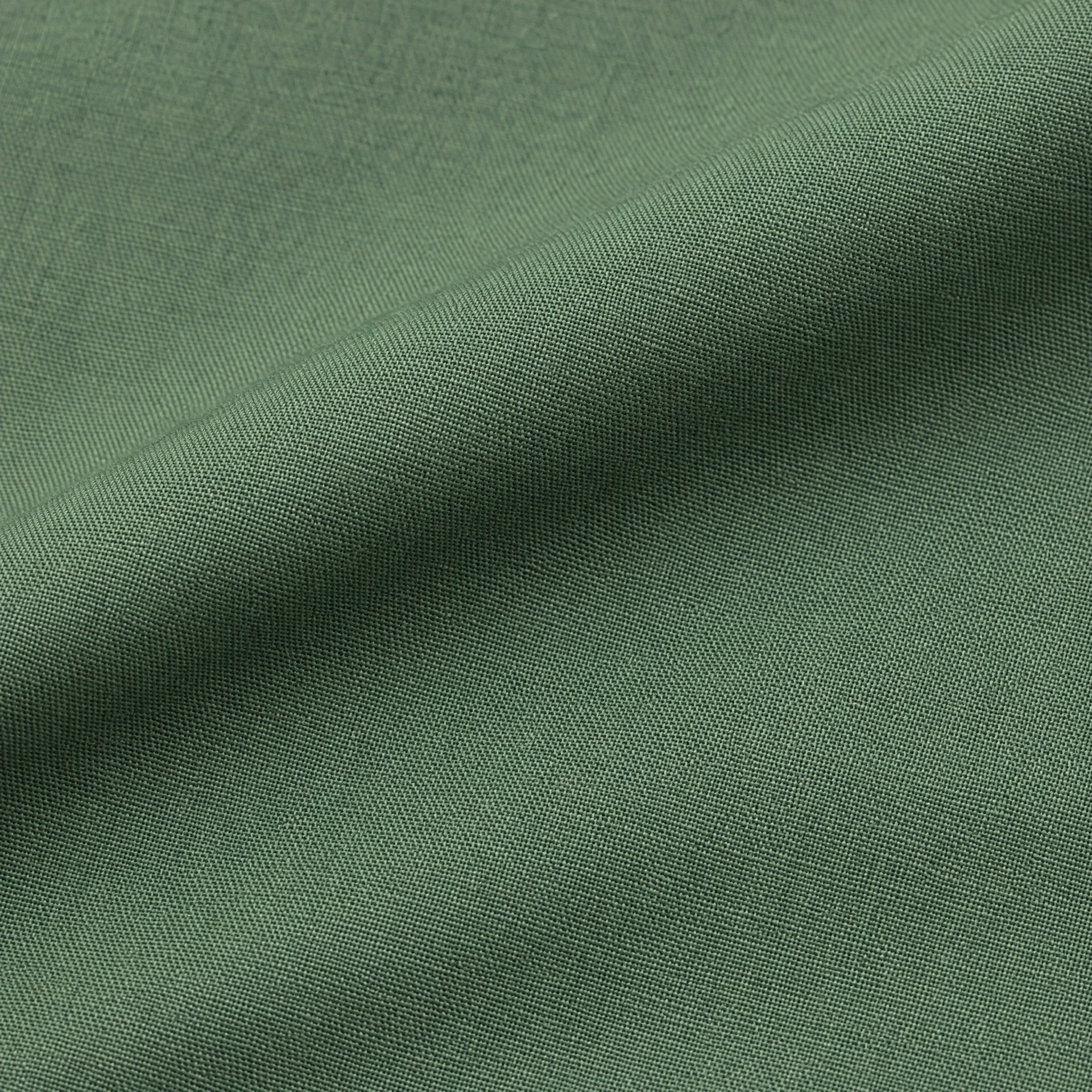 The fine weave of sage cotton fabric